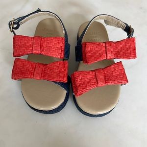 Janie and Jack sandals size 5. Runs large to me. Red and navy blue.